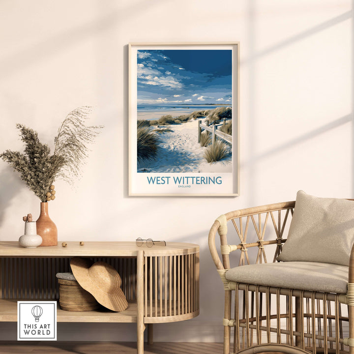 West Wittering poster showcasing Sussex dunes, framed in a cozy living space with coastal decor.