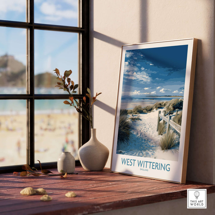 West Wittering poster framed by a window, showcasing Sussex dunes and coastal beauty, ideal for home decor.