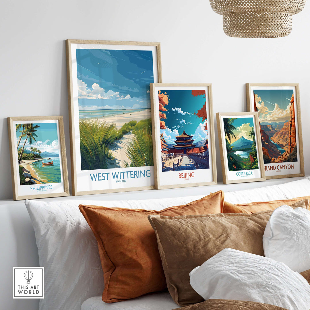 West Wittering Print and other travel posters displayed in a modern home setting, showcasing scenic landscapes.