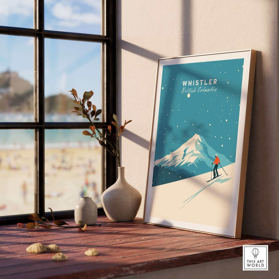 Whistler ski poster displayed on a windowsill, featuring a skier on a snowy mountain under a clear blue sky.