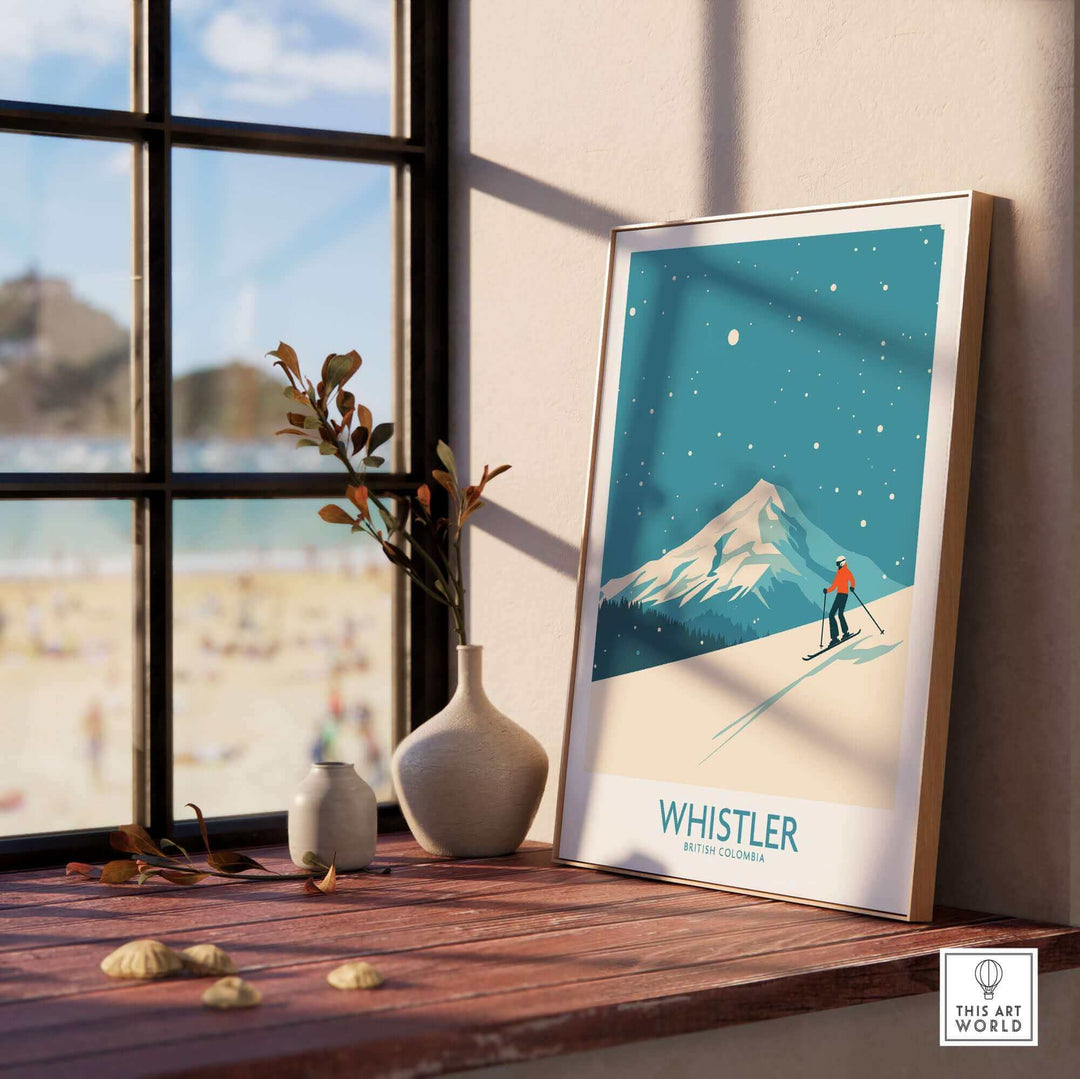 Whistler ski poster print displayed on sunny windowsill, featuring snowy mountain in British Columbia.