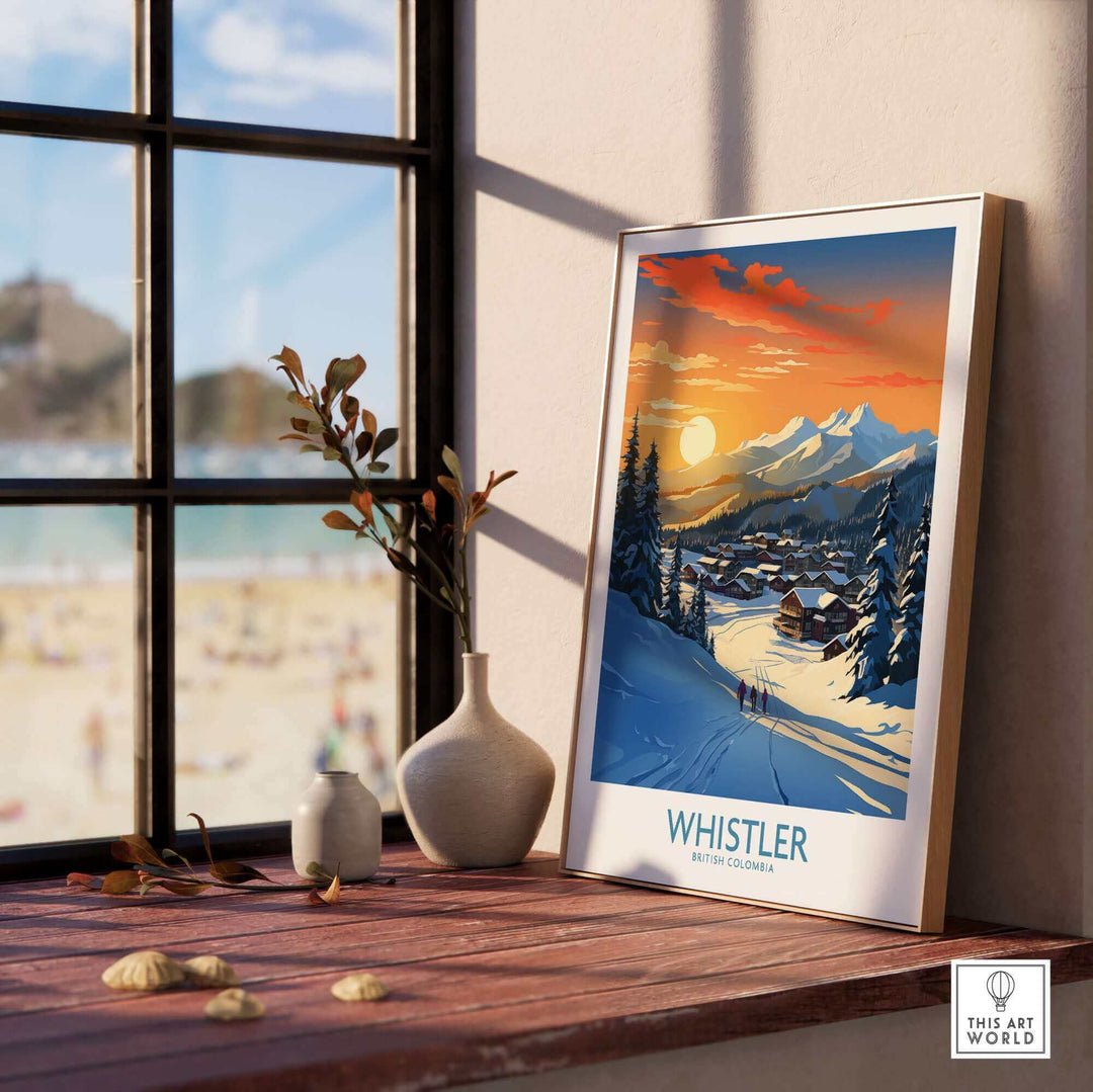 Whistler Wall Art Ski Poster featuring a sunset over snowy mountains, displayed on a windowsill with vases and a beach view.