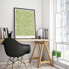 Exhibition Art Print William Morris Willow Pattern Green Botanical Wall Art displayed in a modern workspace interior.