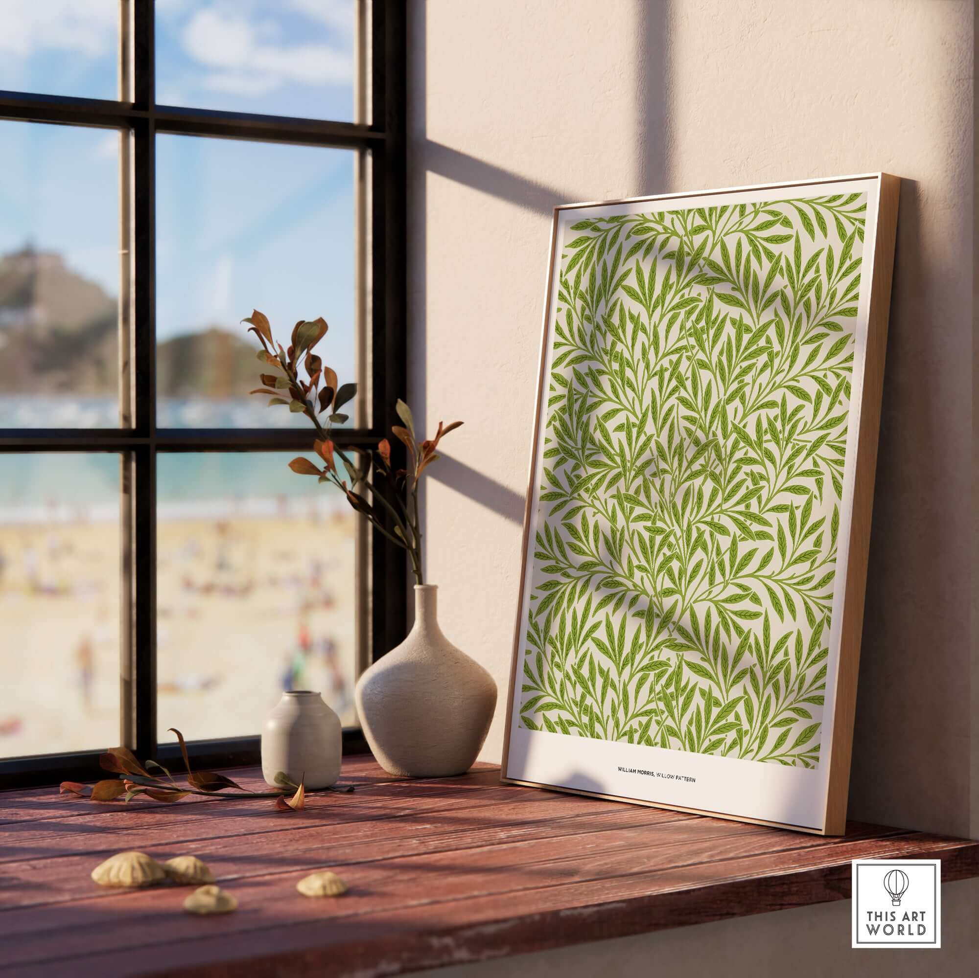 Exhibition Art Print William Morris Willow Pattern Green Botanical Wall Art displayed by a window with beach view.