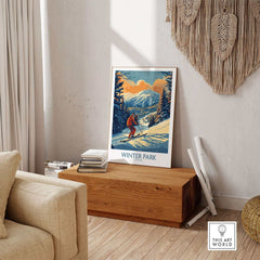 Ski Poster featuring Winter Park Colorado scene with vintage design, displayed in cozy room setting.