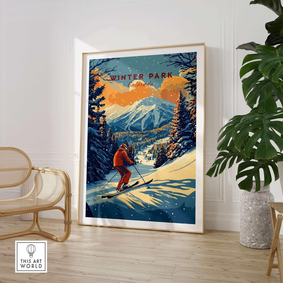 Ski poster of Winter Park, Colorado with skier on mountain, framed art print in modern room, featuring snowy landscape and sunset.