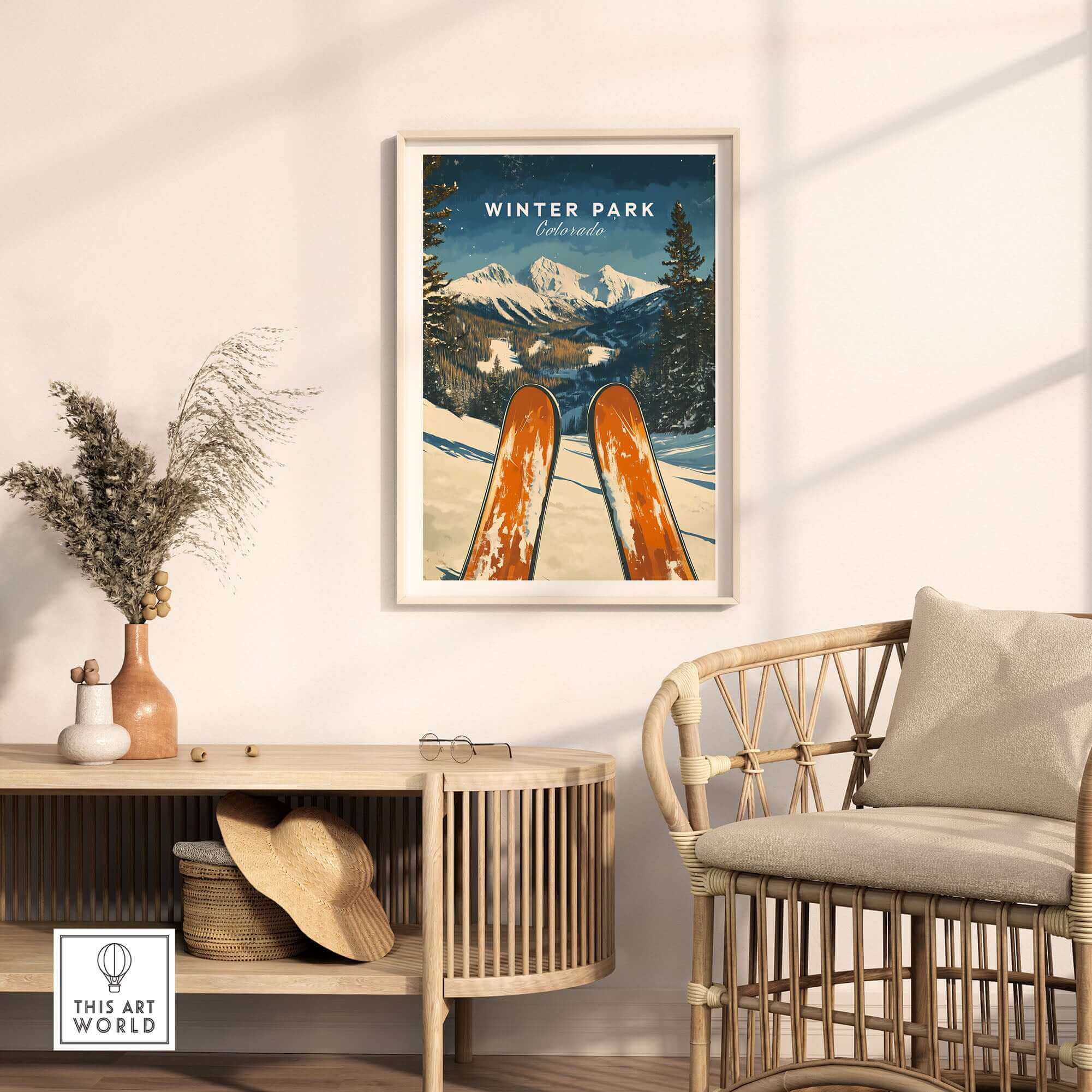 Winter Park Ski Poster featuring snowy Colorado mountains in a cozy living space with natural decor and rattan chair.