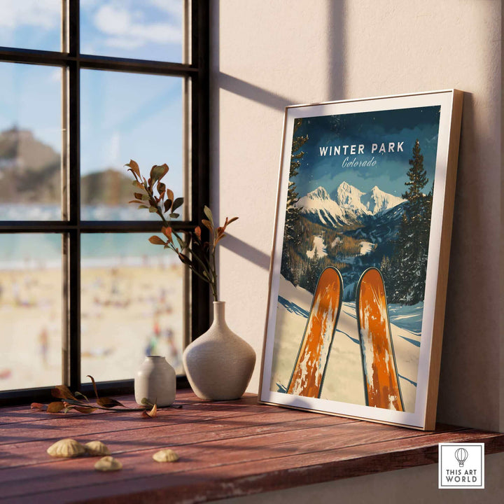 Winter Park Ski Poster featuring snowy Colorado mountains displayed on a windowsill with decorative vases.