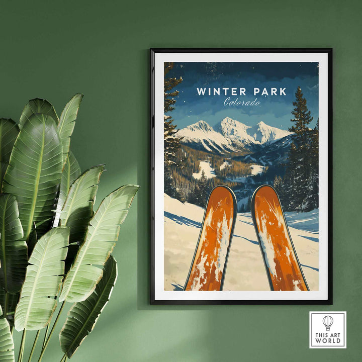 Ski poster of Winter Park, Colorado with a scenic mountain view, displayed on a green wall, featuring two skis in the foreground.