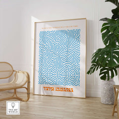 Yayoi Kusama Blue Infinity Net Pattern Abstract Art Print Paris Exhibition Poster framed in a modern interior setting.