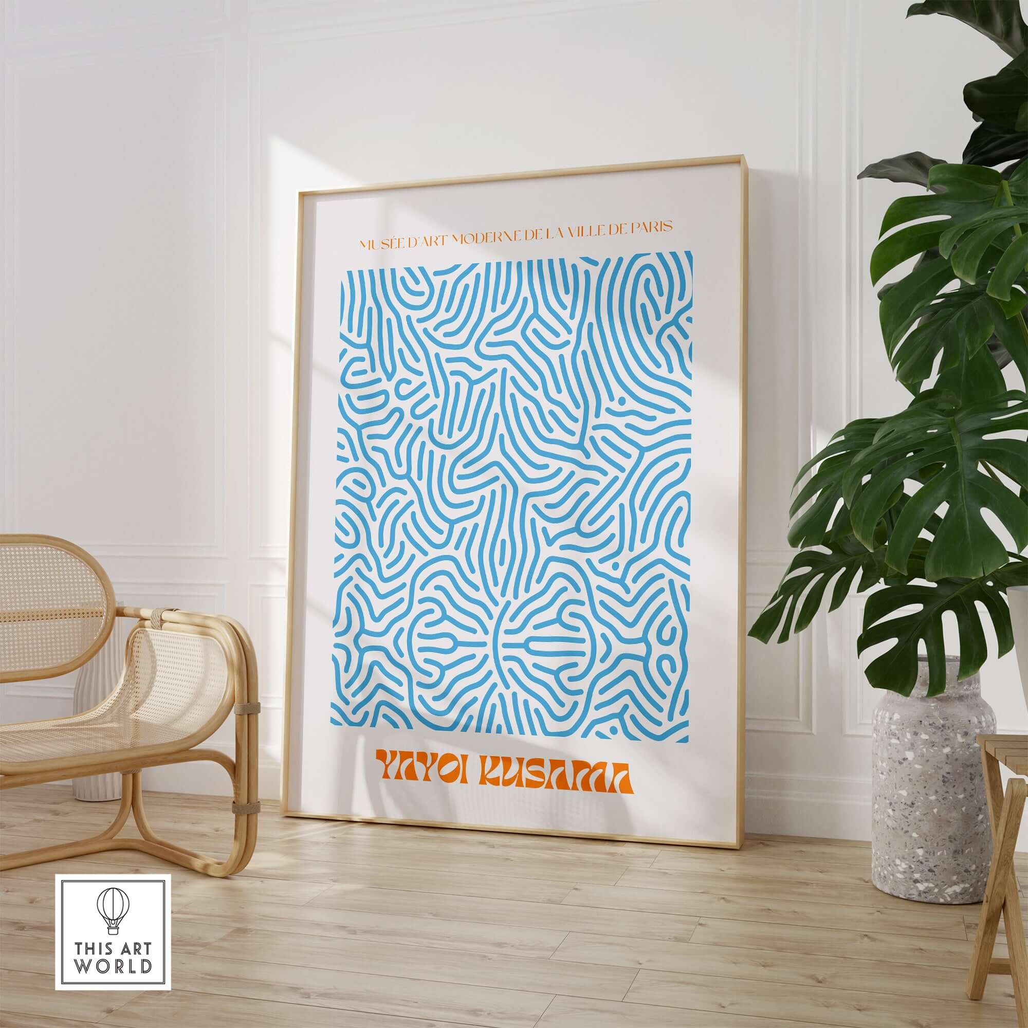 Yayoi Kusama Blue Infinity Net Pattern Abstract Art Print Paris Exhibition Poster framed in a modern interior setting.