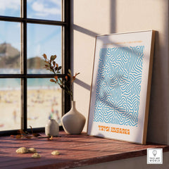 Yayoi Kusama Blue Infinity Net Pattern Abstract Art Print Paris Exhibition Poster displayed by a window with beach view.
