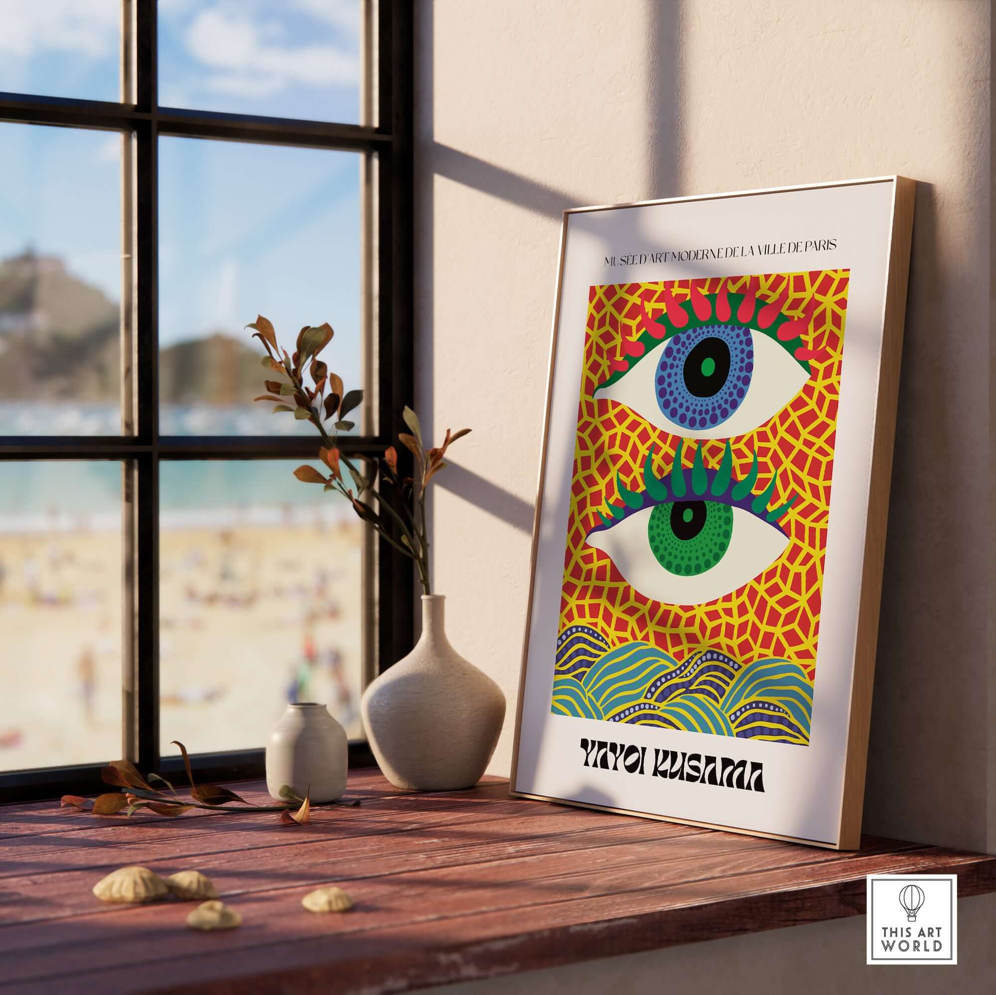 Yayoi Kusama Colorful Eyes Abstract Pattern Contemporary Art Print Paris Poster displayed in a bright room with beach view.