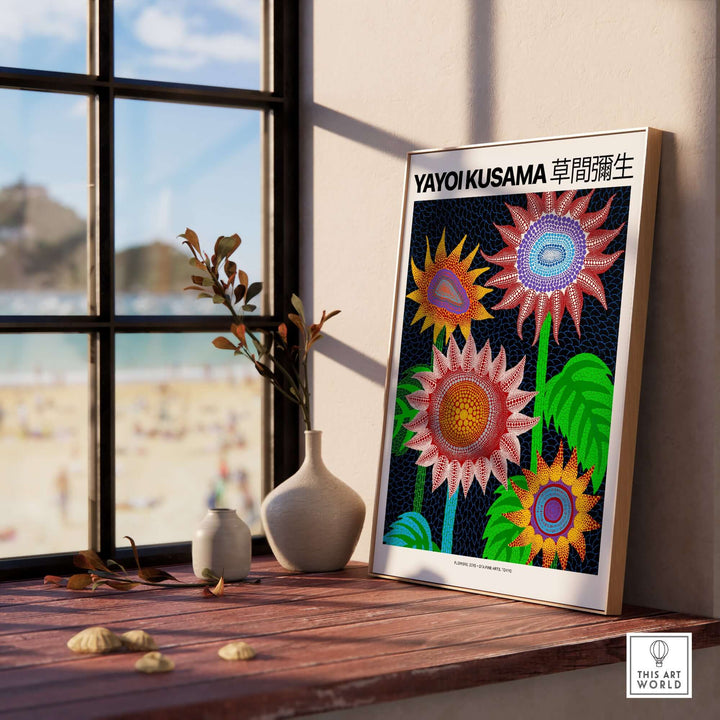 Yayoi Kusama colorful flowers art print poster on a windowsill, featuring vibrant blooms and polka dot patterns.