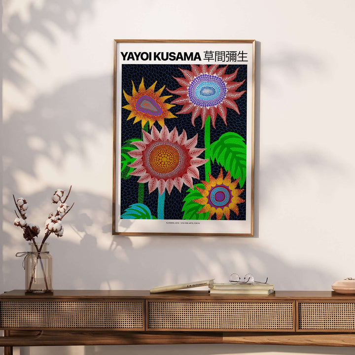 Yayoi Kusama Colorful Flowers art print featuring bright blooms and polka dots on a dark blue background.