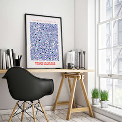Yayoi Kusama Evil Eye Pattern Blue Contemporary Art Print Poster Paris Wall Decor framed in a modern workspace.