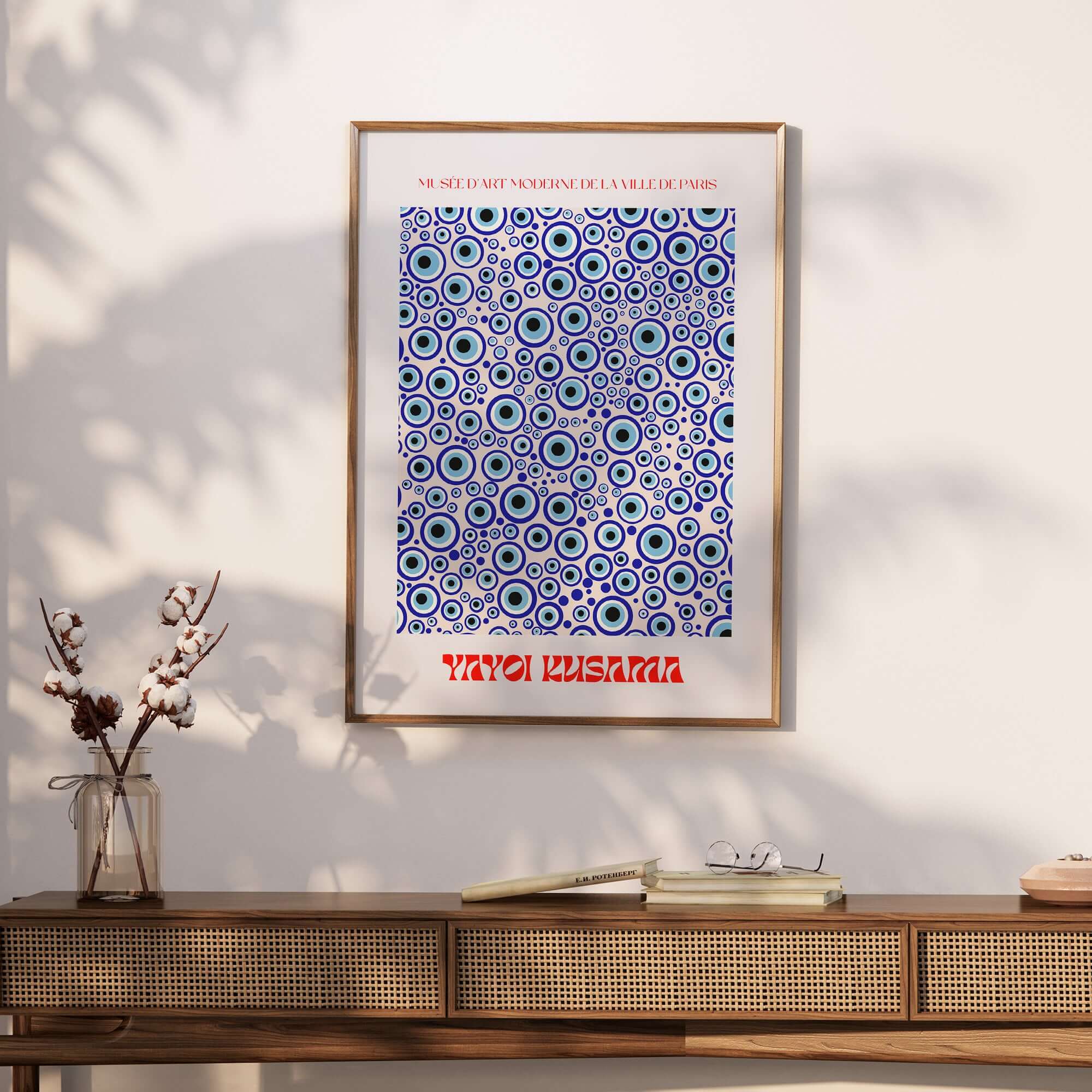 Yayoi Kusama Evil Eye Pattern Blue Contemporary Art Print Poster Paris Wall Decor featured in a modern interior setting.