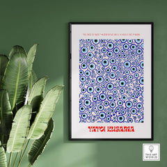 Yayoi Kusama Evil Eye Pattern Blue Contemporary Art Print Poster Paris Wall Decor displayed in a stylish frame with greenery.