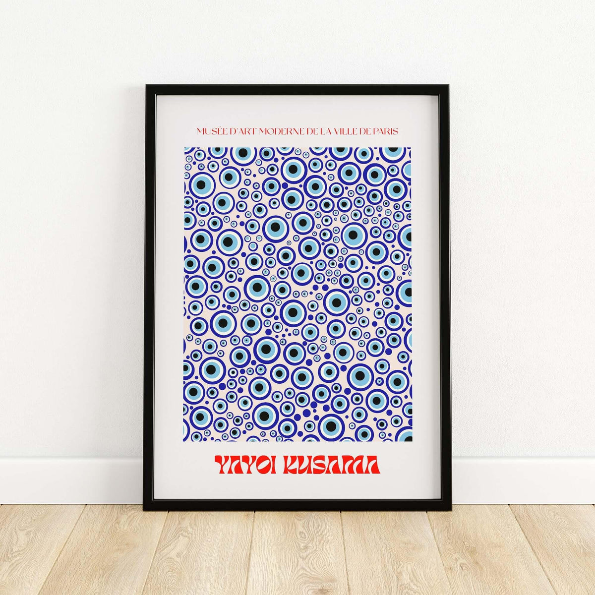 Yayoi Kusama Evil Eye Pattern Blue Contemporary Art Print Poster Paris Wall Decor in a modern black frame on display.