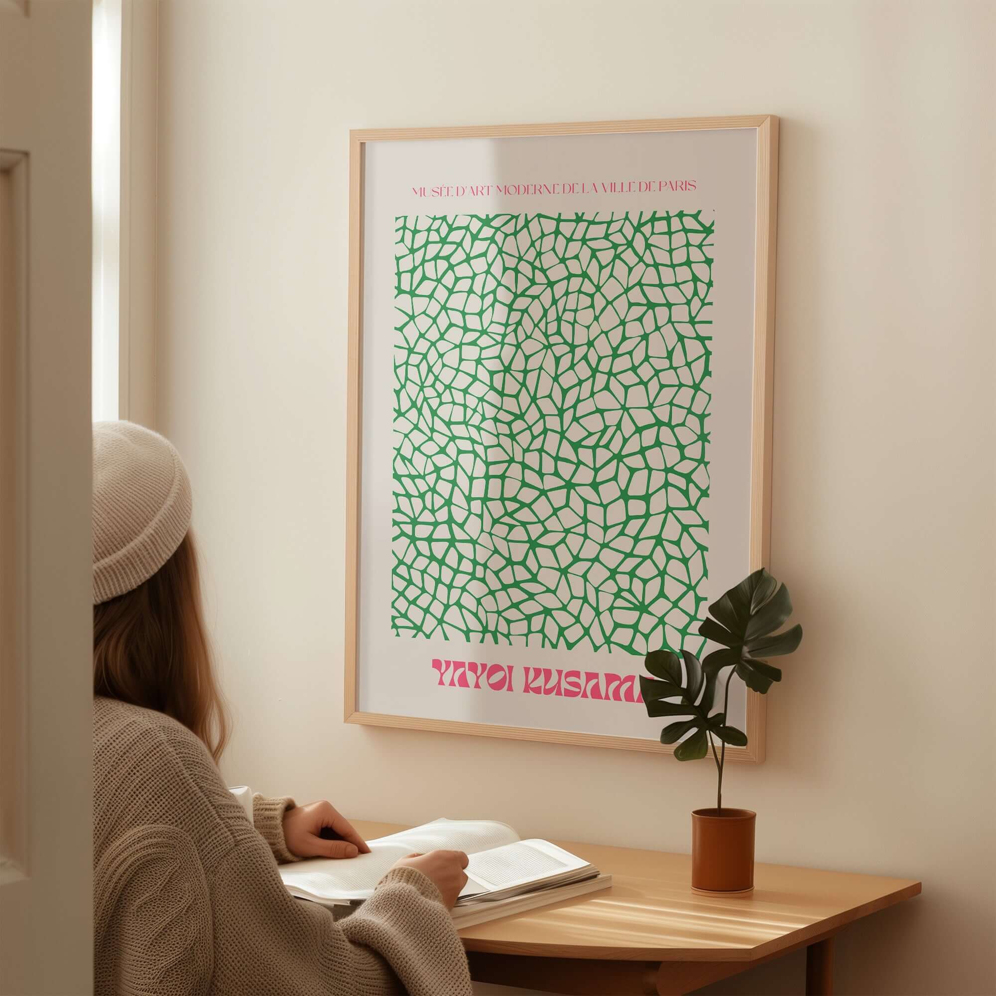 Yayoi Kusama Green Net Pattern Abstract Contemporary Art Print Paris Poster Decor displayed in modern interior with plant.