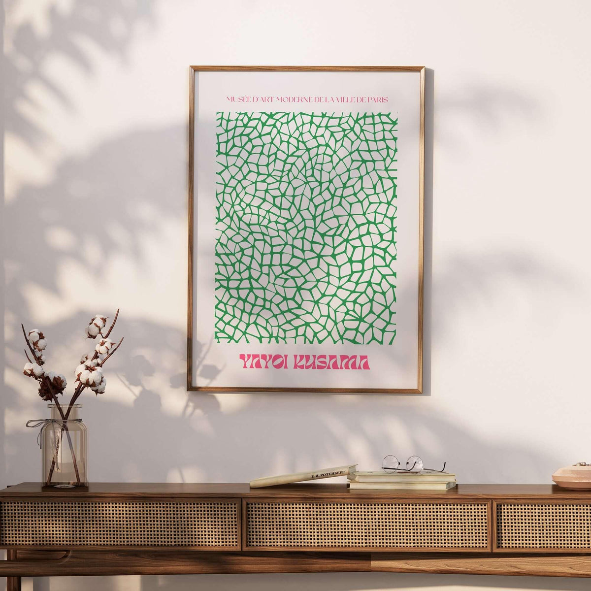 Yayoi Kusama Green Net Pattern Abstract Contemporary Art Print Paris Poster Decor displayed on a wall with natural sunlight.