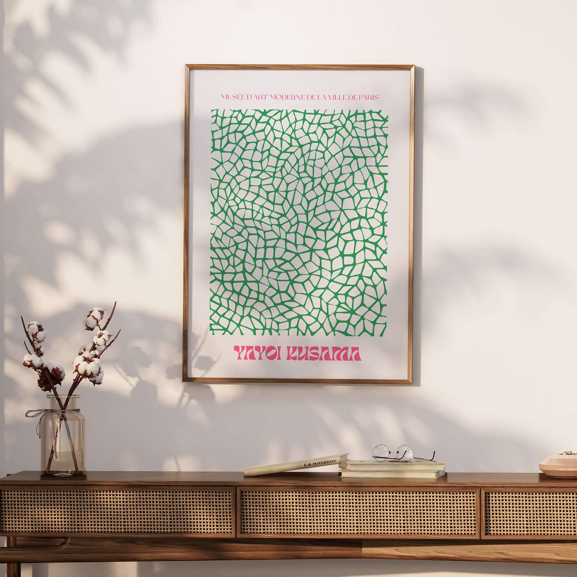 Yayoi Kusama Green Net Pattern Abstract Contemporary Art Print Paris Poster Decor displayed on a wall with natural sunlight.
