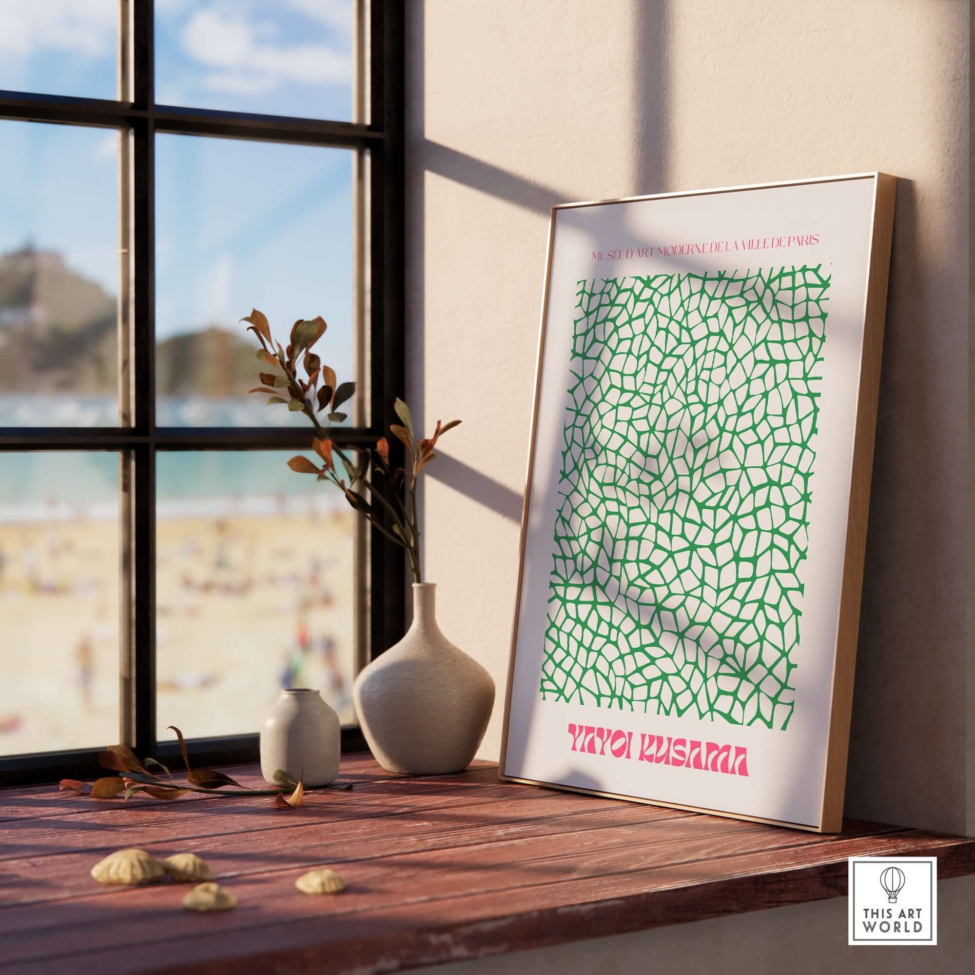 Yayoi Kusama Green Net Pattern Abstract Contemporary Art Print Paris Poster Decor displayed on a windowsill with beach view.