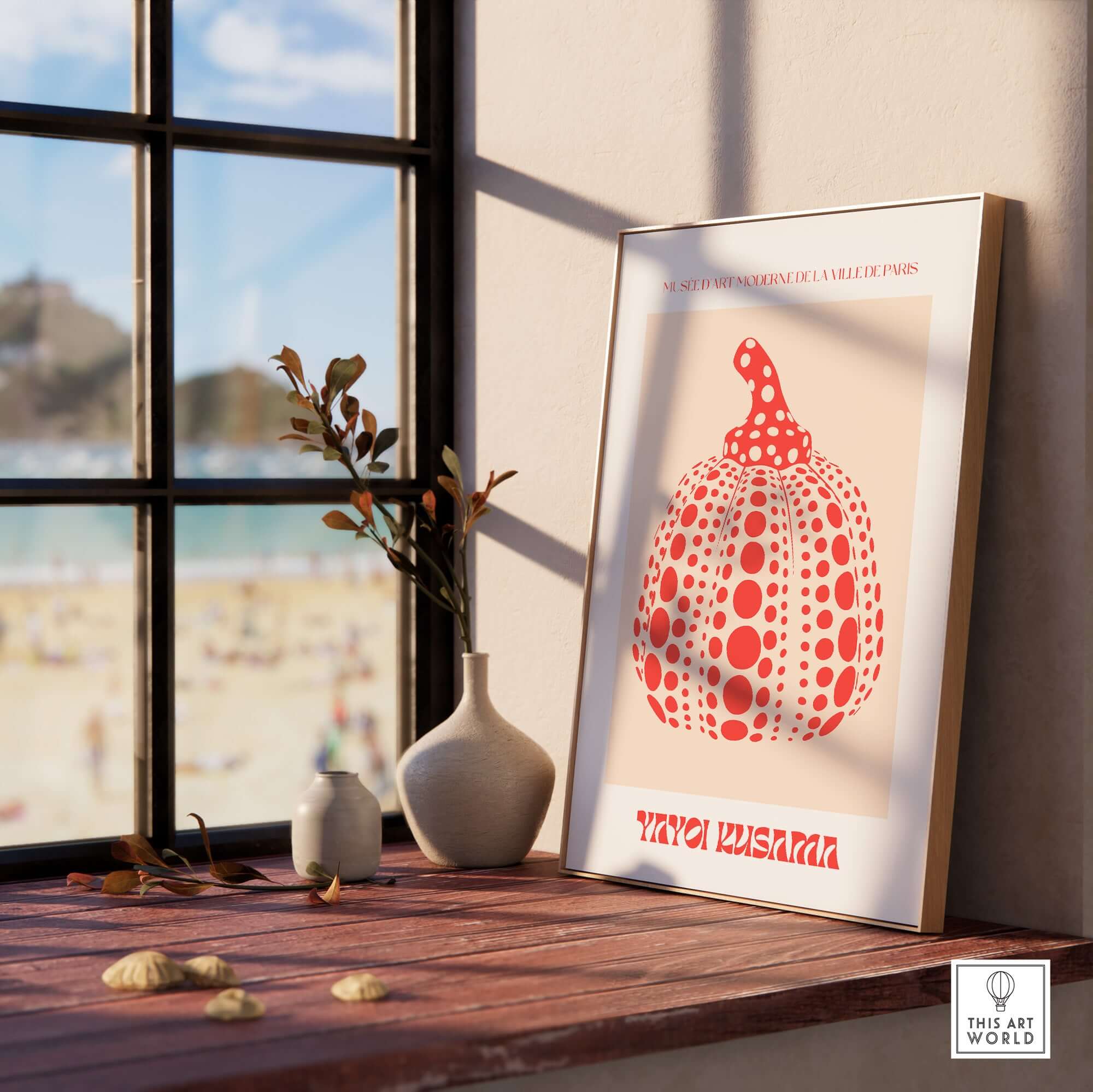 Yayoi Kusama Red Pumpkin Polka Dot Pop Art Print Poster Paris Exhibition Wall Art displayed on a table by a window.