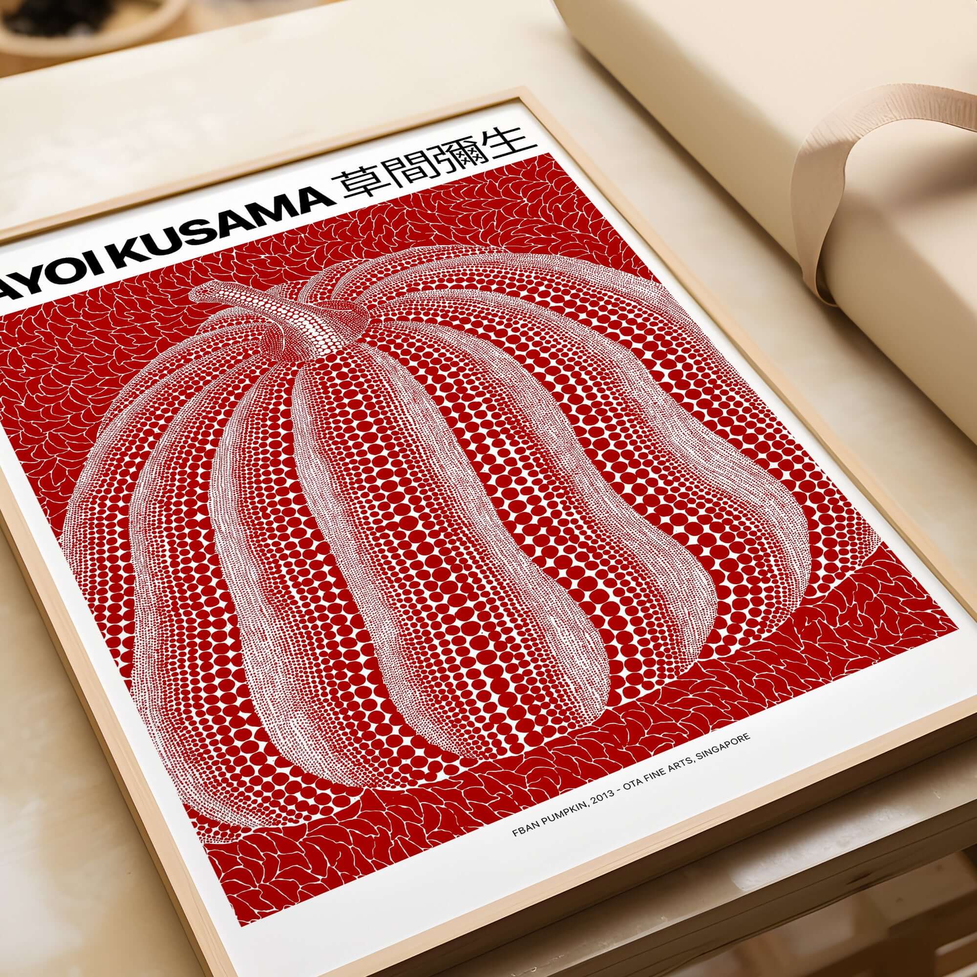 Yayoi Kusama Red White Pumpkin 2013 Singapore Exhibition Art Print Poster Polka Dot on a light colored surface.
