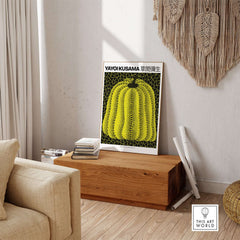 Yayoi Kusama Yellow Black Pumpkin 1991 Hong Kong Art Print Poster Polka Dot Decor displayed in a cozy room setting.