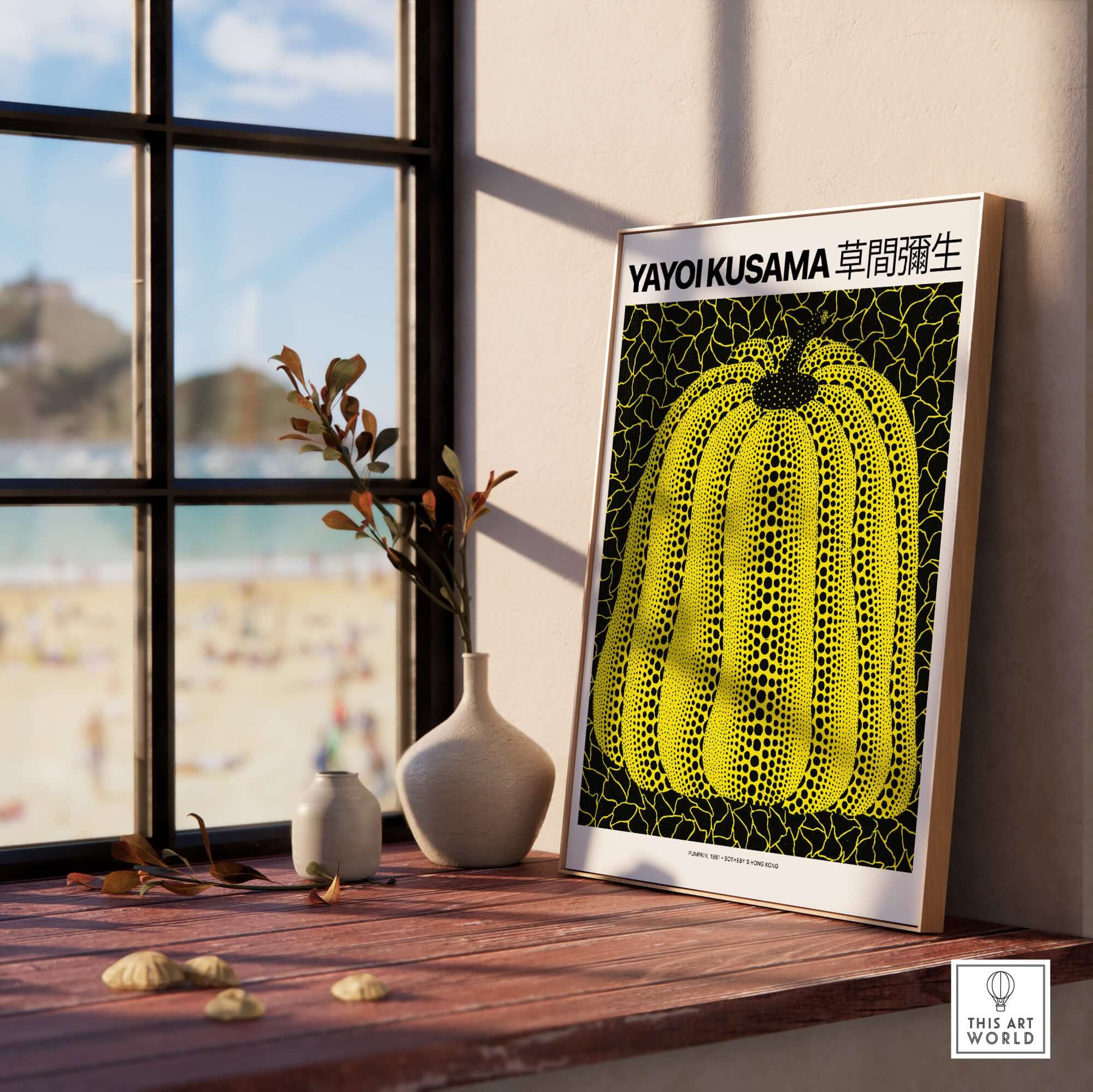 Yayoi Kusama Yellow Black Pumpkin 1991 Hong Kong Art Print Poster Polka Dot Decor displayed on a wooden table.