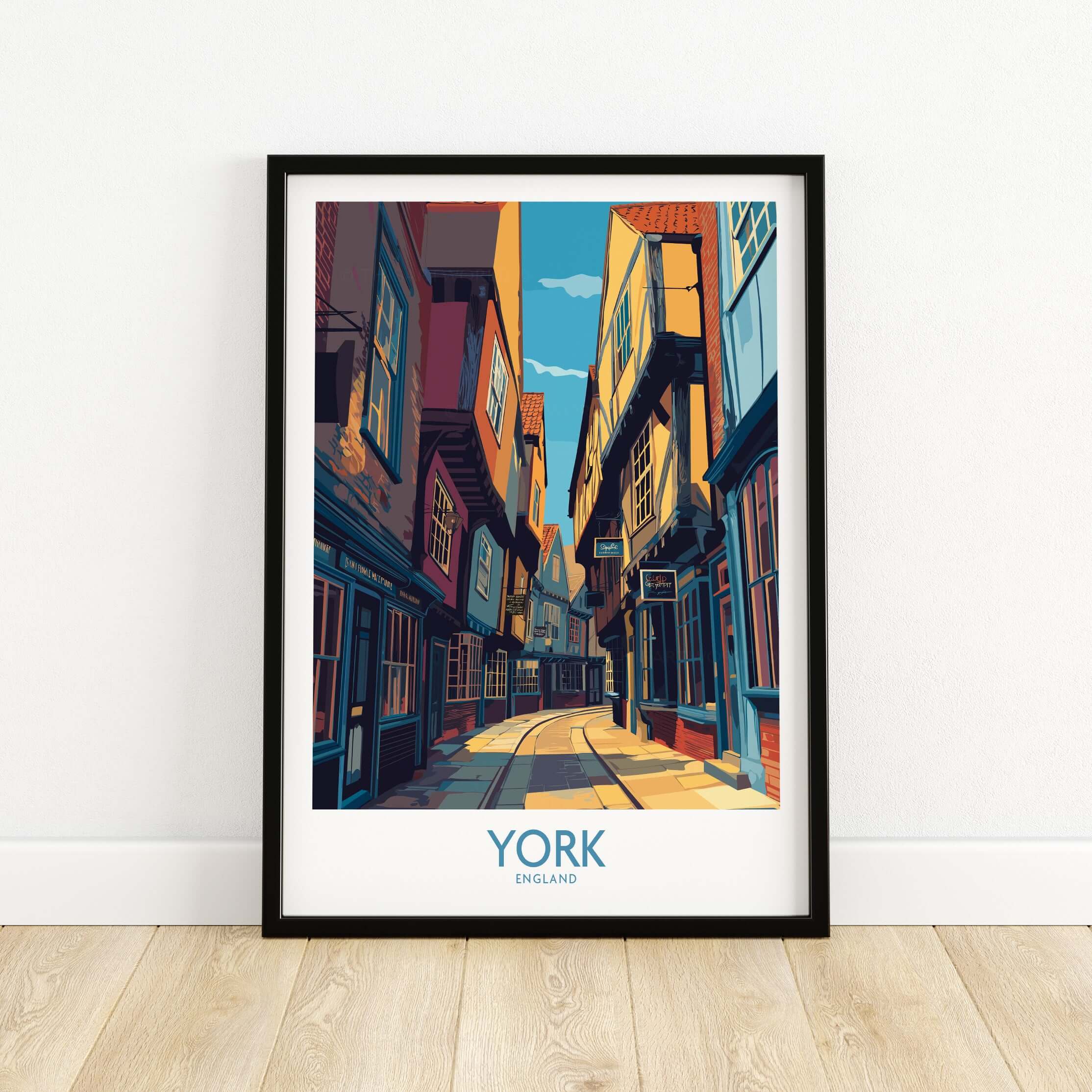 York England Cobblestone Street Print - Historic UK Wall Decor featuring vibrant architecture in a framed print.