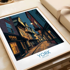 York England Historic Street at Dusk Poster - Evening Cityscape Decor framed on a table, showcasing a serene evening cityscape.