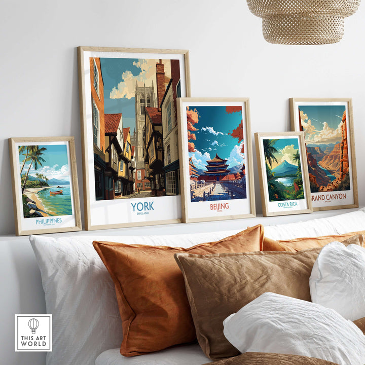 York England historic street wall art alongside framed prints of worldwide landmarks on a stylish couch.