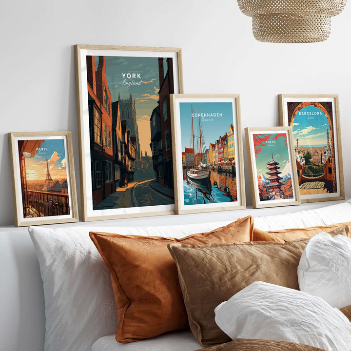 York England medieval street sunset print alongside other cityscape posters in a stylish living room setting.