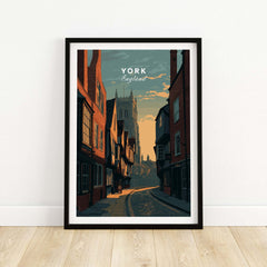 York England Medieval Street Sunset Print - Historic Cityscape Poster in a framed display on wooden floor.