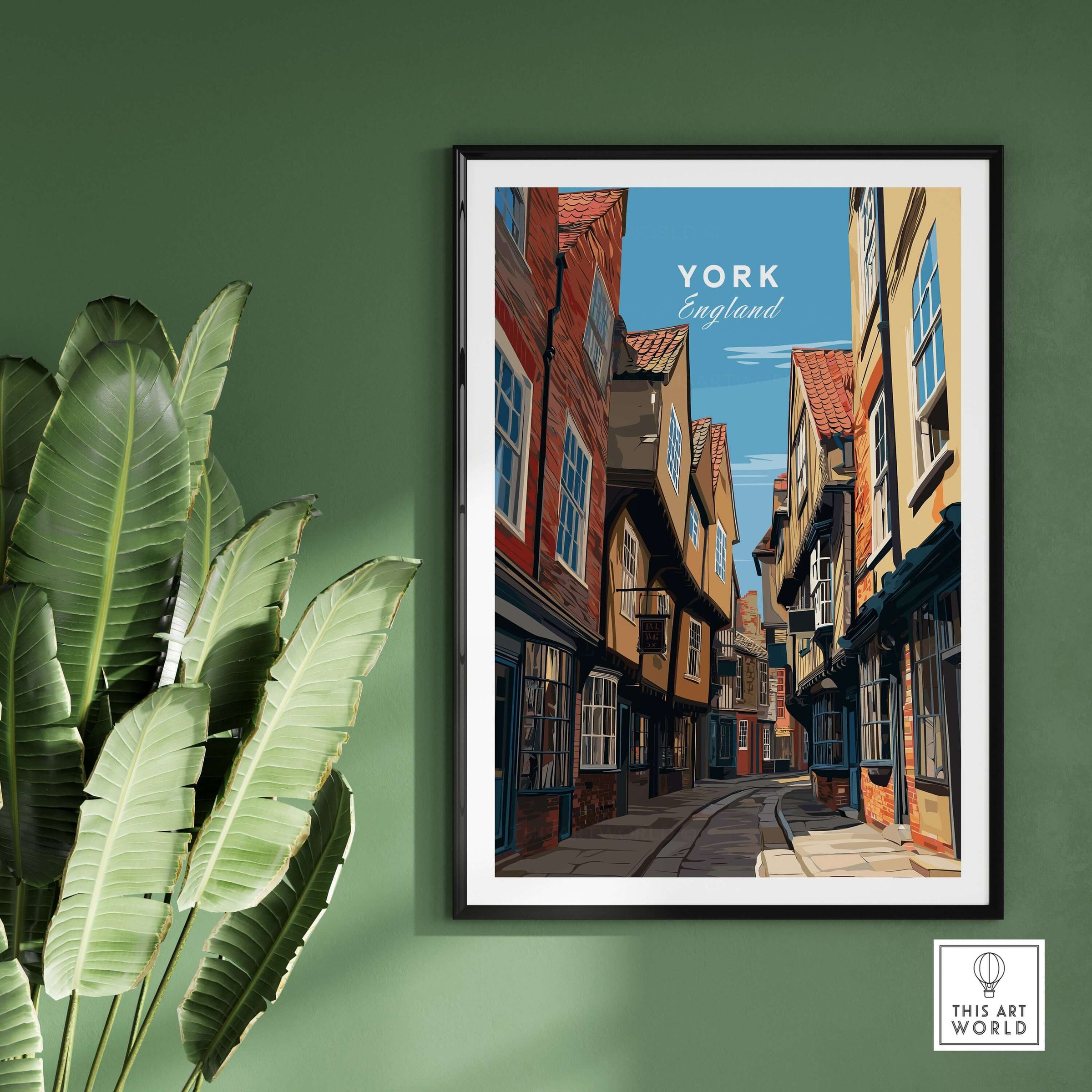 York England The Shambles Street Print - Historic City Lane Wall Art framed on green wall with plants.