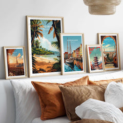 Zanzibar Poster on display with other travel posters in a stylish living room setting, showcasing beautiful beach scenery.