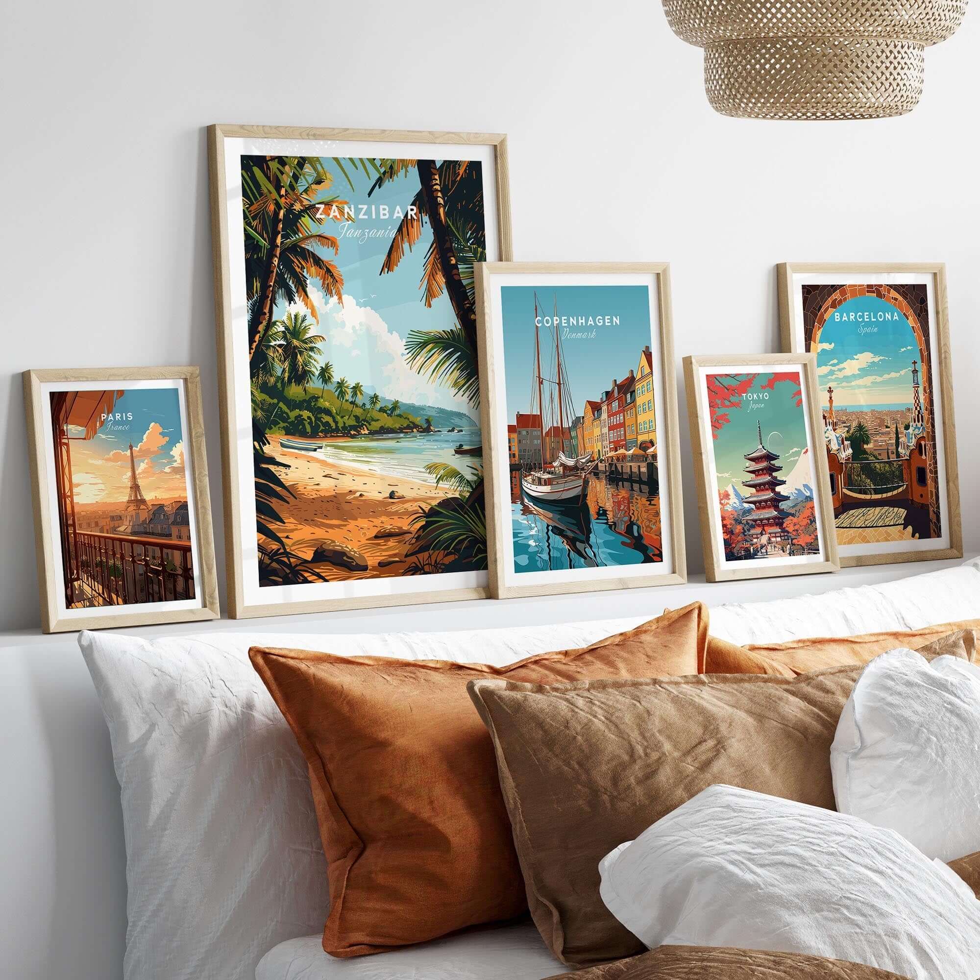 Zanzibar Poster on display with other travel posters in a stylish living room setting, showcasing beautiful beach scenery.