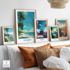 Zanzibar Travel Print - Tanzania featured among other travel prints on a stylish couch, showcasing vibrant colors and beach vibes.