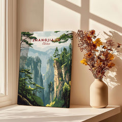 Zhangjiajie China Art Print | Misty Forest Canyon Poster displayed near a vase of dried flowers in a sunlit room.
