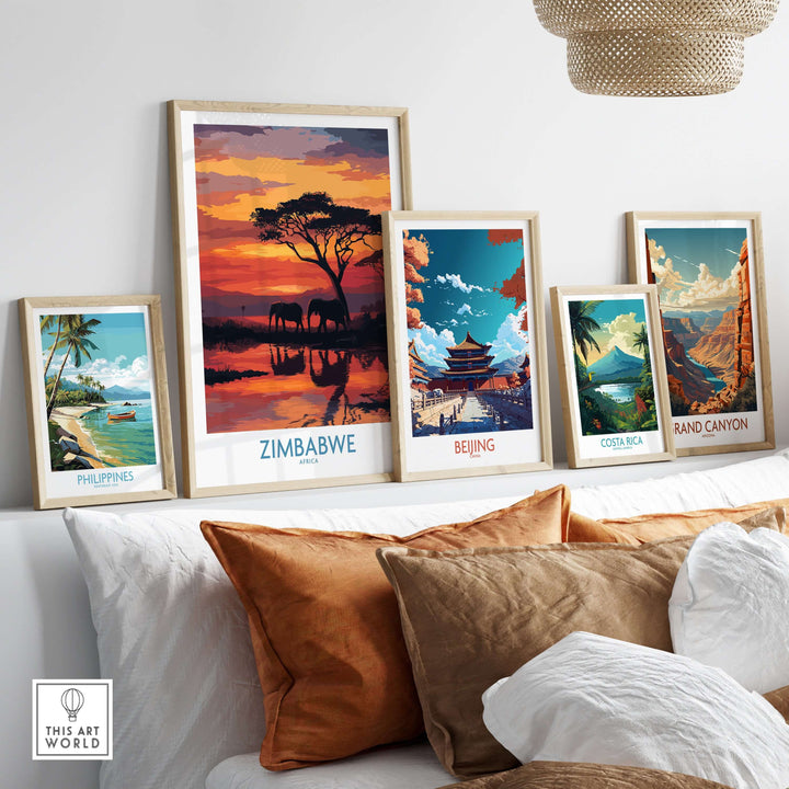 Gallery wall featuring Zimbabwe elephant poster and landscape art from Philippines, Beijing, Costa Rica, and Grand Canyon.