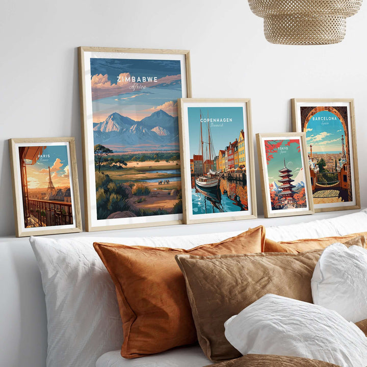 Zimbabwe poster and various travel prints in stylish frames on a cozy couch, showcasing global destinations and landscapes.