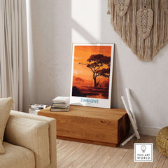 Zimbabwe Safari Sunset Poster - Africa Giraffe Wall Art - Wildlife Travel Print displayed in a stylish living room setting.