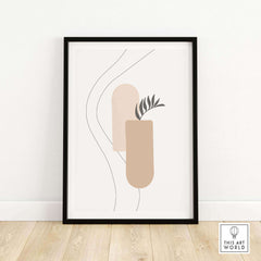 Framed Palm Leaf Print featuring abstract shapes and plant design, perfect for modern wall art in home or office.