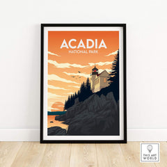 Framed Acadia National Park wall art print showcasing a lighthouse and sunset over rocky cliffs.