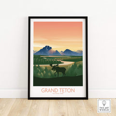 Grand Teton National Park art print in a black frame, featuring mountains and a moose against a sunset background.