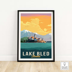Framed Lake Bled print featuring mountains and sunset colors, perfect for home or office decor.