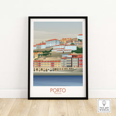 Framed Porto Wall Art print showcasing colorful buildings along the Portugal riverfront, perfect for travel-inspired decor.