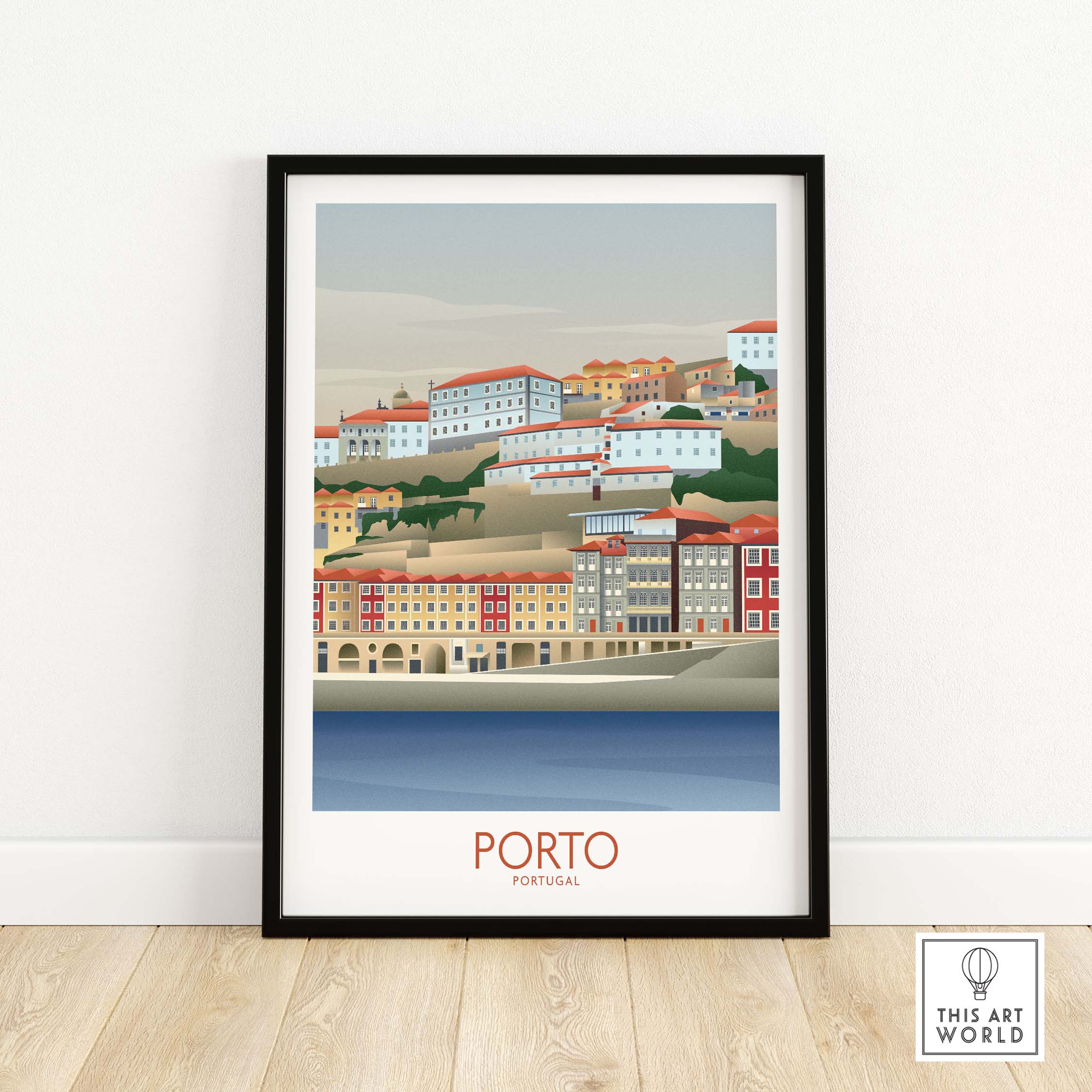 Framed Porto Wall Art print showcasing colorful buildings along the Portugal riverfront, perfect for travel-inspired decor.